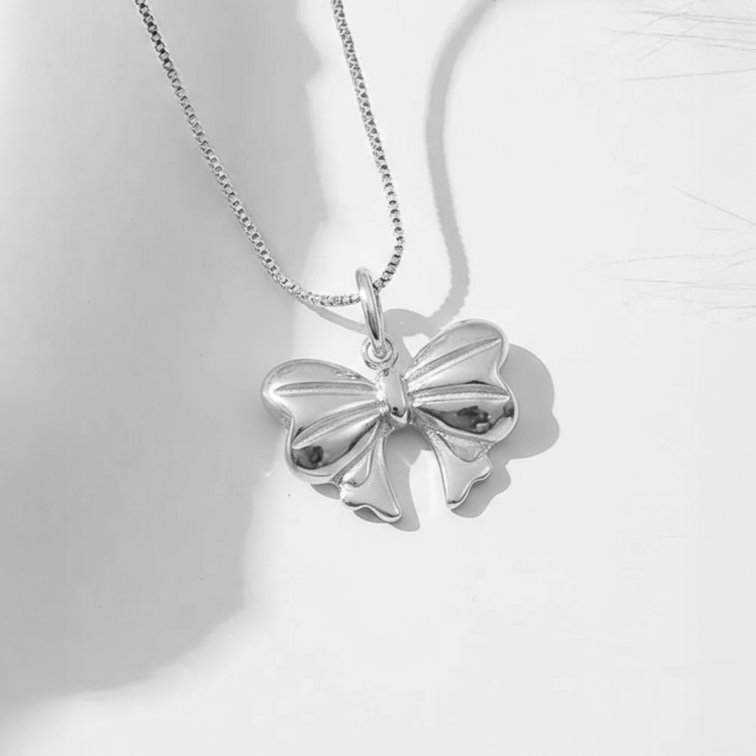 Silver Bow Pendant – Elegant Stainless Steel Ribbon Necklace Charm