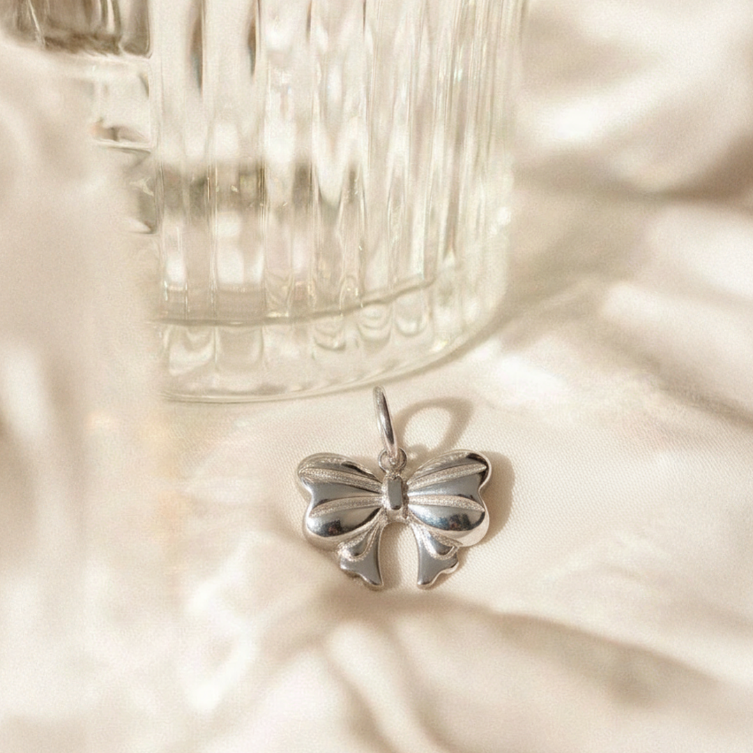 Silver Bow Pendant – Elegant Stainless Steel Ribbon Necklace Charm
